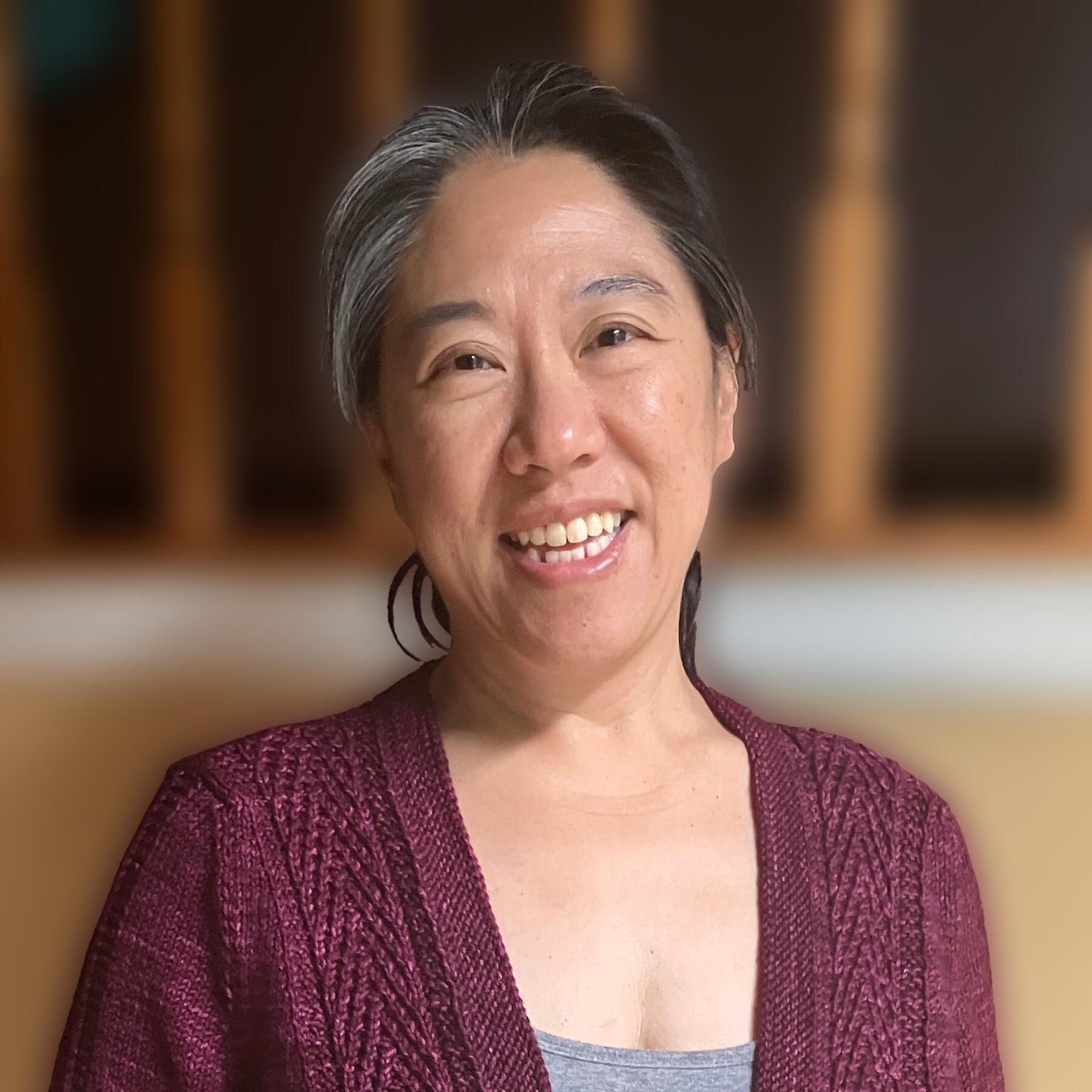 Headshot of Carol wearing her Silver Fir cardigan